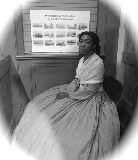  Robbins House Humanities Director Elon Cook poses as Ellen Garrison at the Baltimore President Street Train Depot where Ellen tested the country’s first Civil Rights Act in 1866. Reenactment courtesy of The Robbins House’s IMLS grant. 
